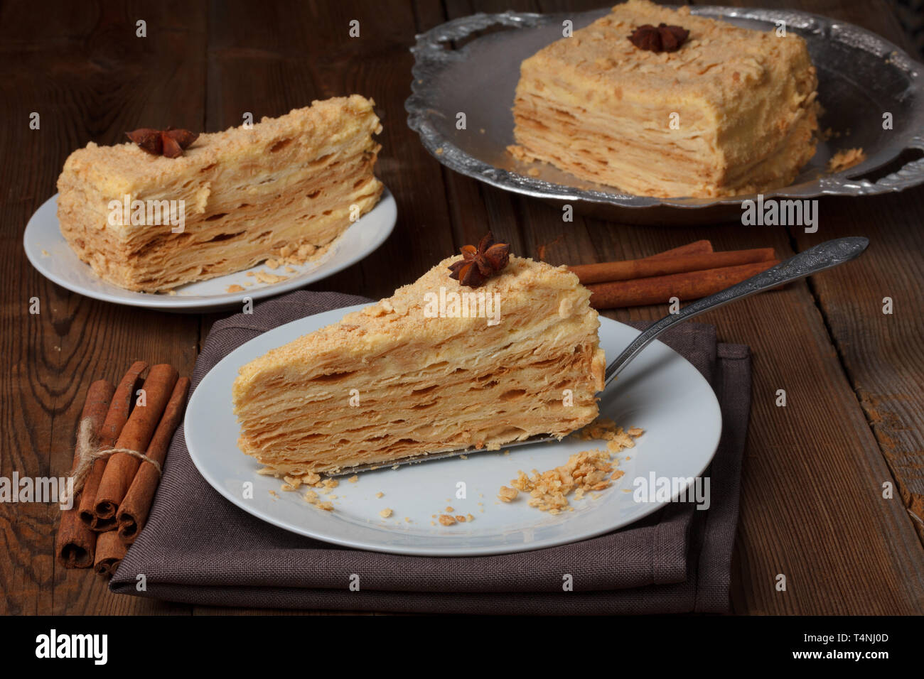 Slice of layer cake on server Stock Photo