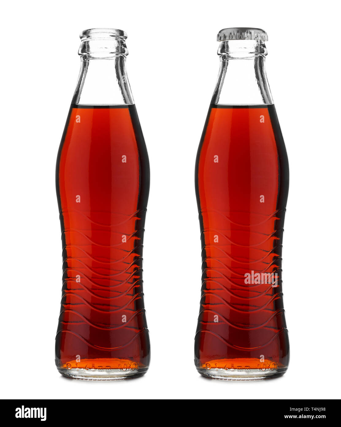 Open and closed glass bottle with soft drink cola or soda isolated on