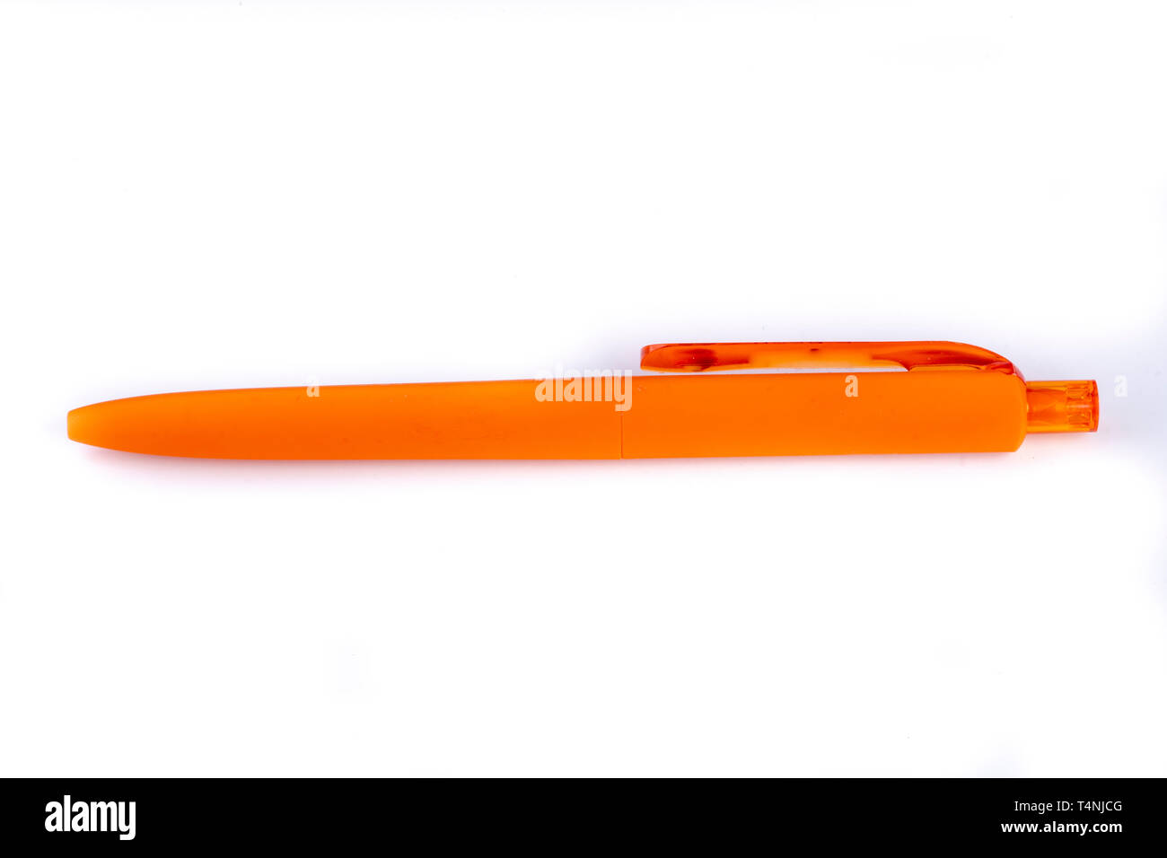 orange ballpoint pen on white Stock Photo
