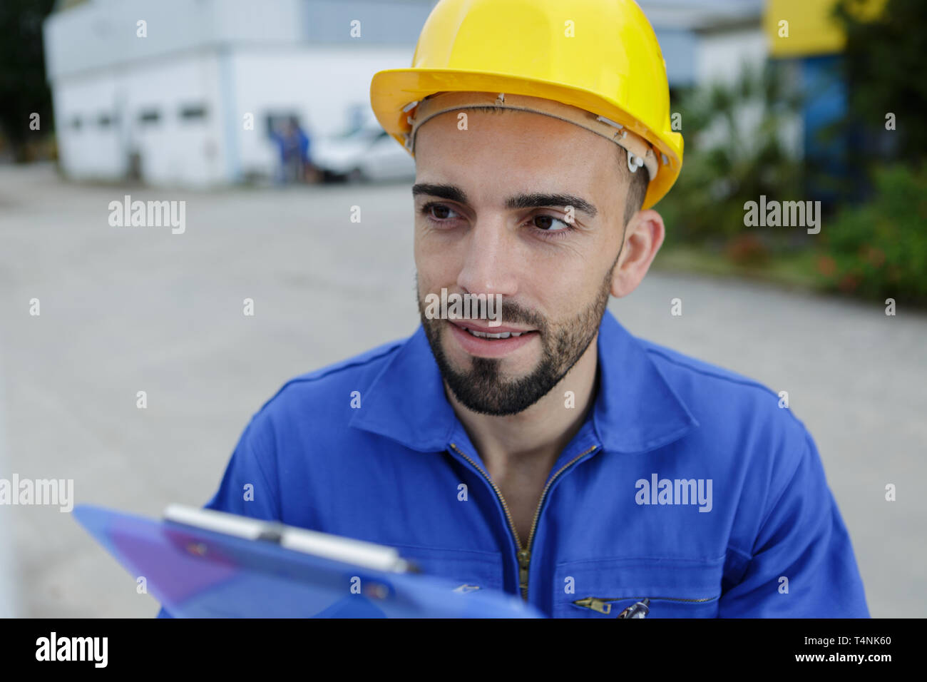 entrepreneur on construction site using electronic tablet Stock Photo