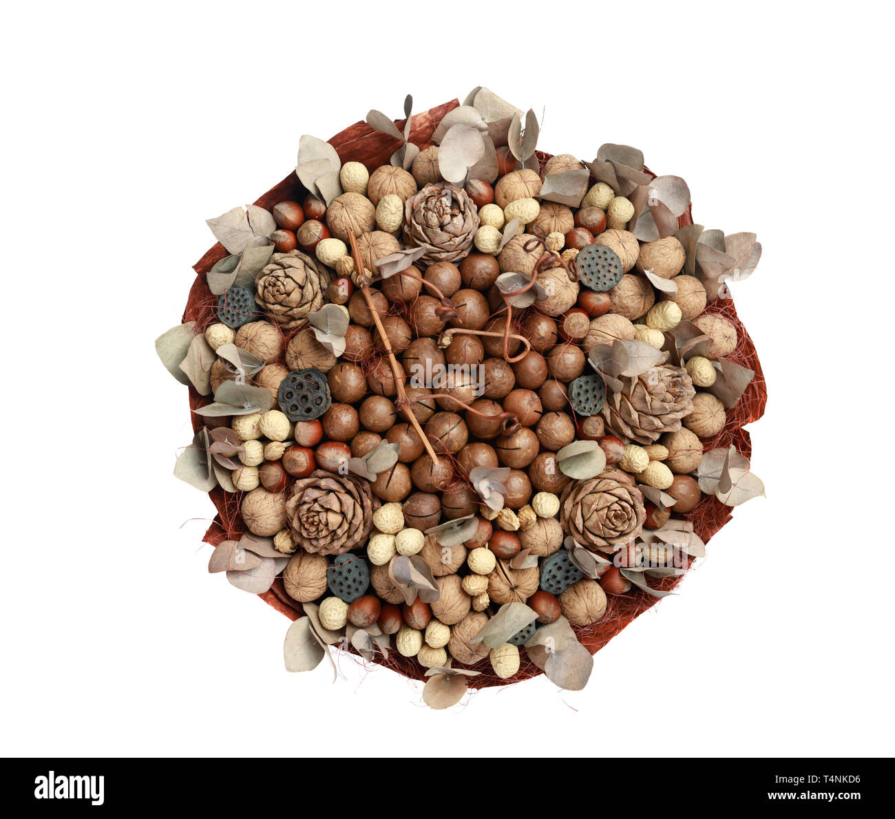 Unique bouquet made up of different types of nuts, decorated with leaves, cones and twigs. Top view on white background Stock Photo