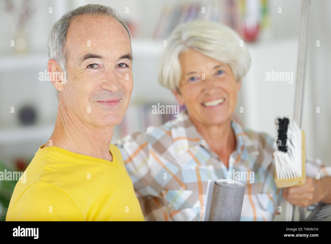 happy senior couple doing diy Stock Photo