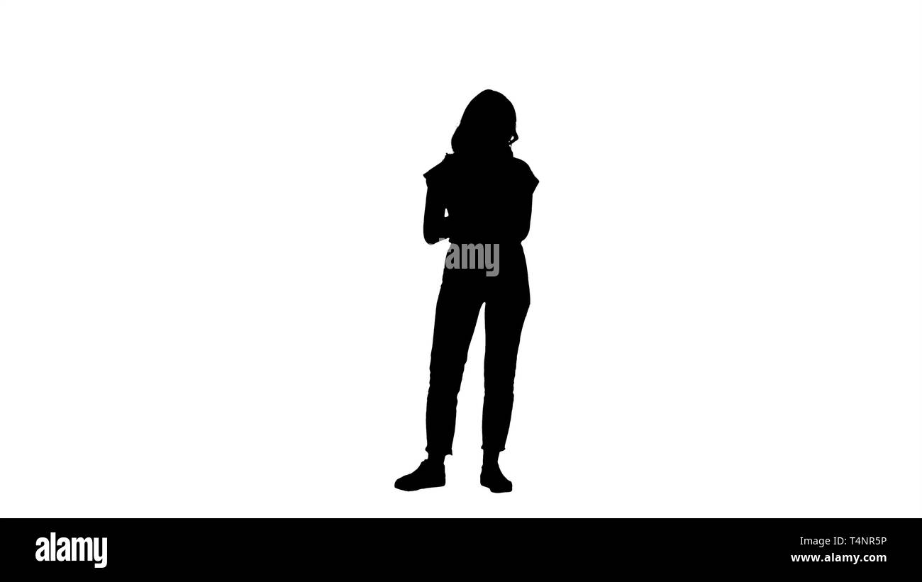 Full length shot. Silhouette Beautiful modern woman using digital tablet. Professional shot in 4K resolution. 006. You can use it e.g. in your commerc Stock Photo