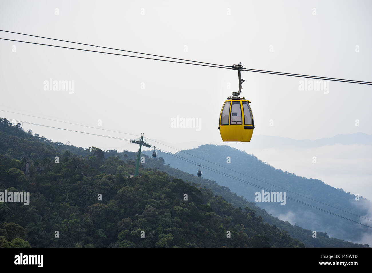 Cable car above hill forest in Vietnam Stock Photo