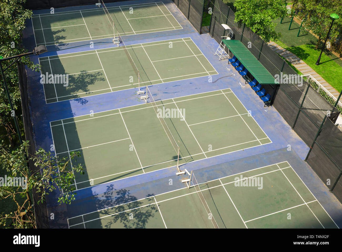Aerial view of badminton courts with surrounded green trees Stock Photo Alamy