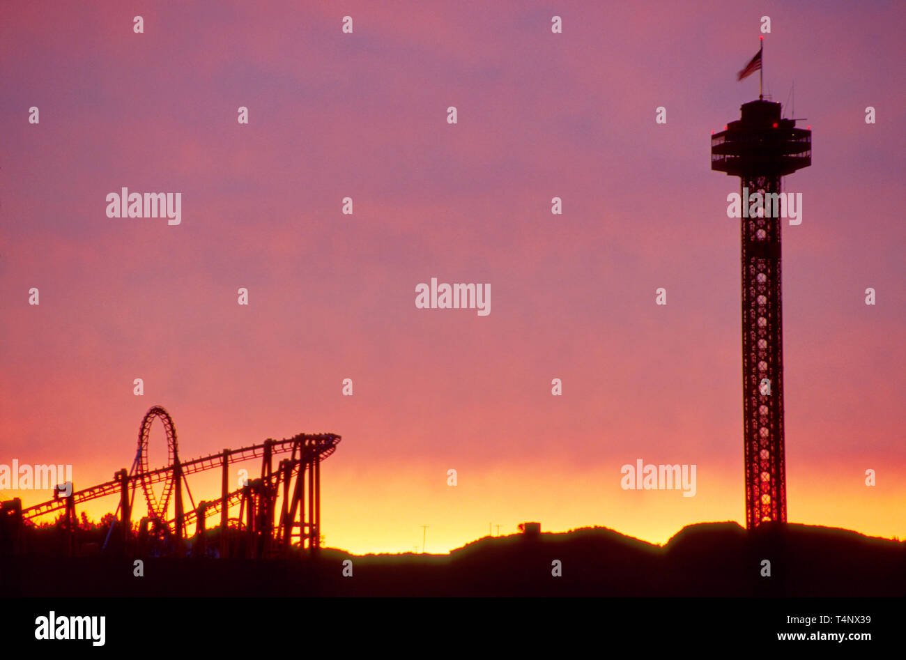 Santa Clarita California,roller coaster silhouetted against sunset,Six