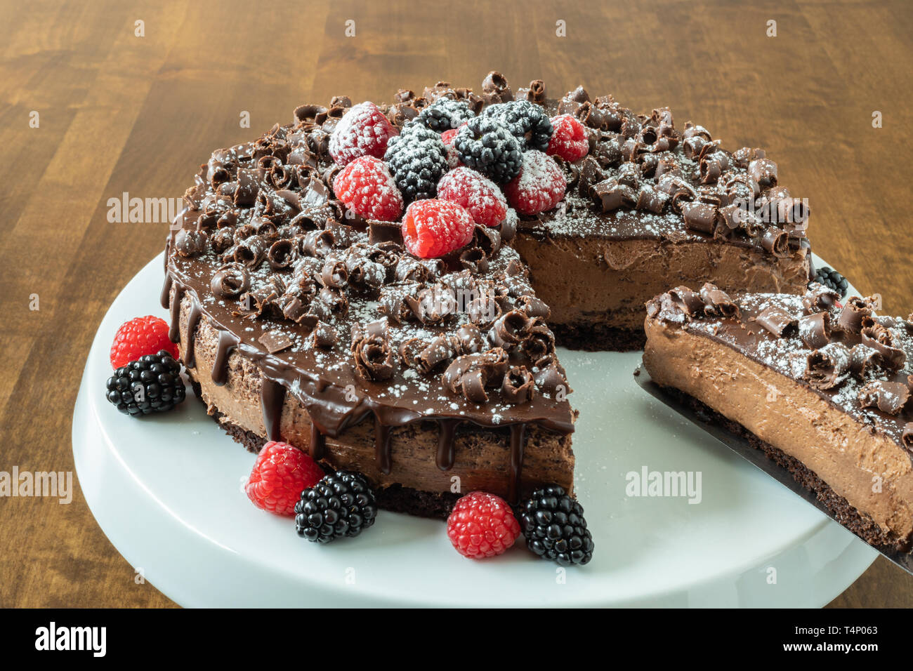 A decadent Chocolate Mousse Cake with chocolate ganache and topped with