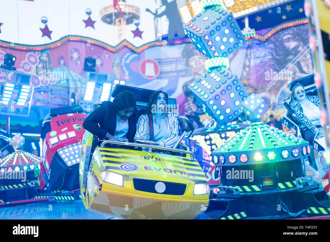 Hamburg, Germany - 17 April 2019: People having fun at DOM amusement park Stock Photo