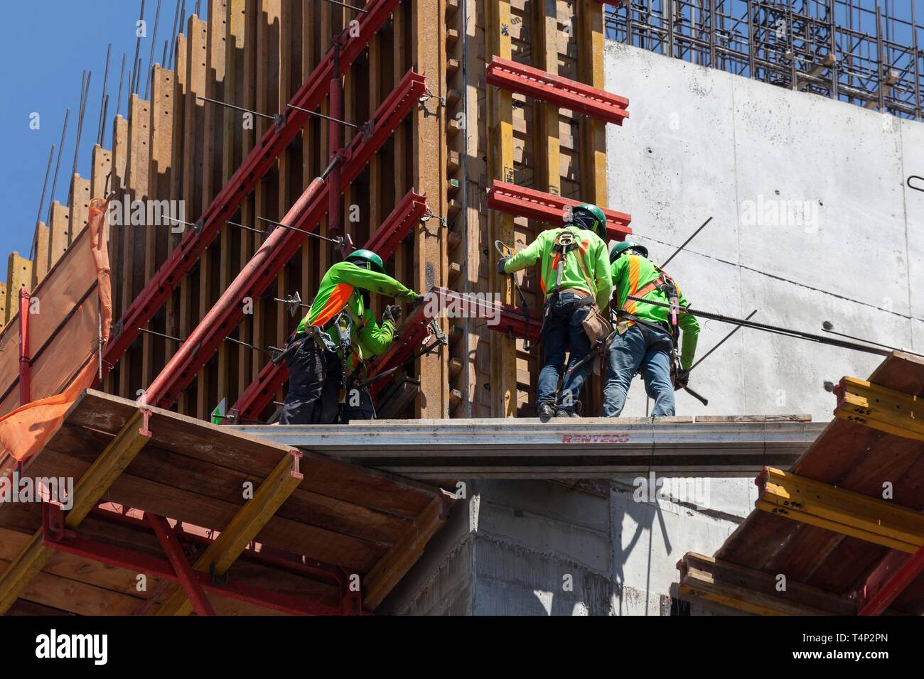 Construction worker on scaffolding on a highrise building, San Jose