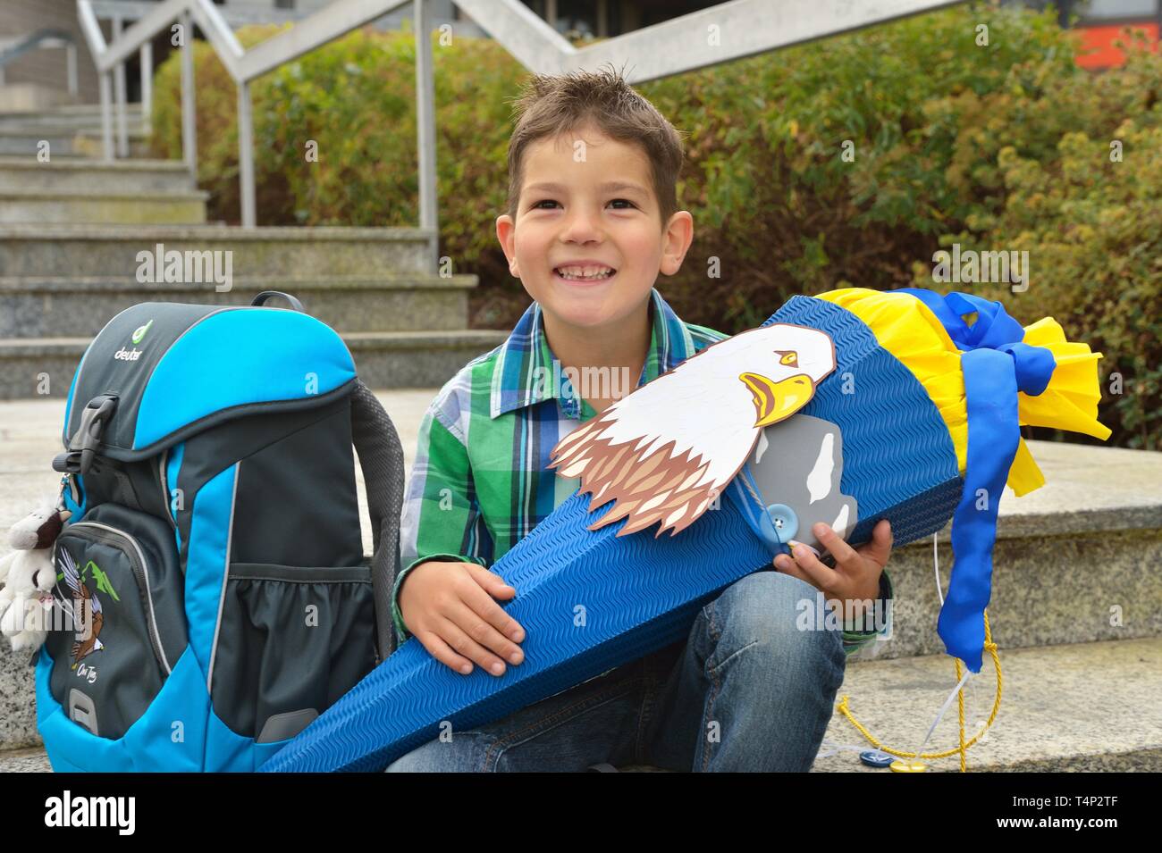 Boy, 6 years, first day at school with school bag and school cone, Portrait, Germany Stock Photo