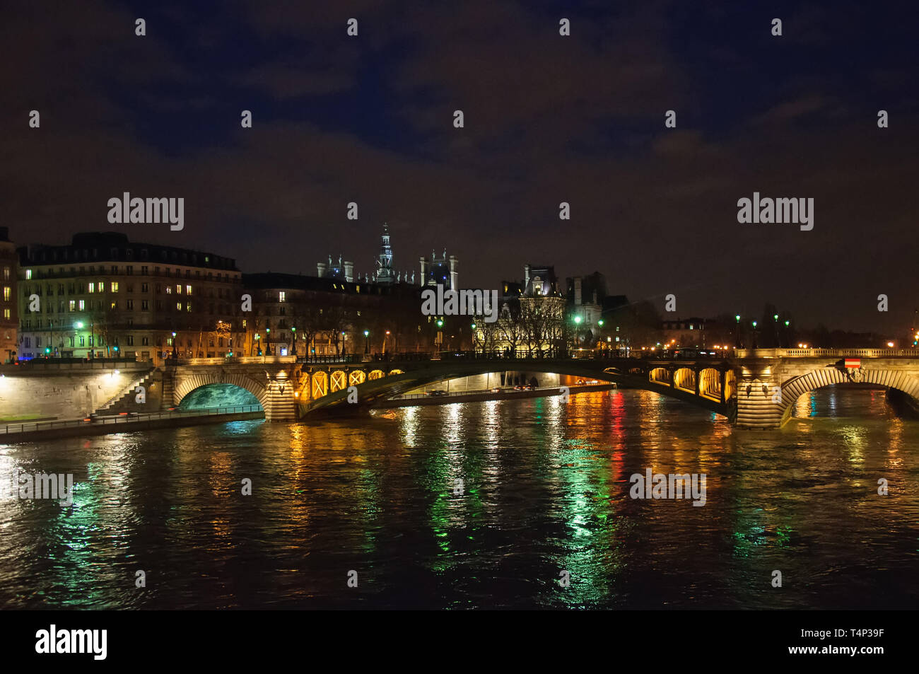 Night city view of the river Seine and bridges in Paris, France Stock Photo