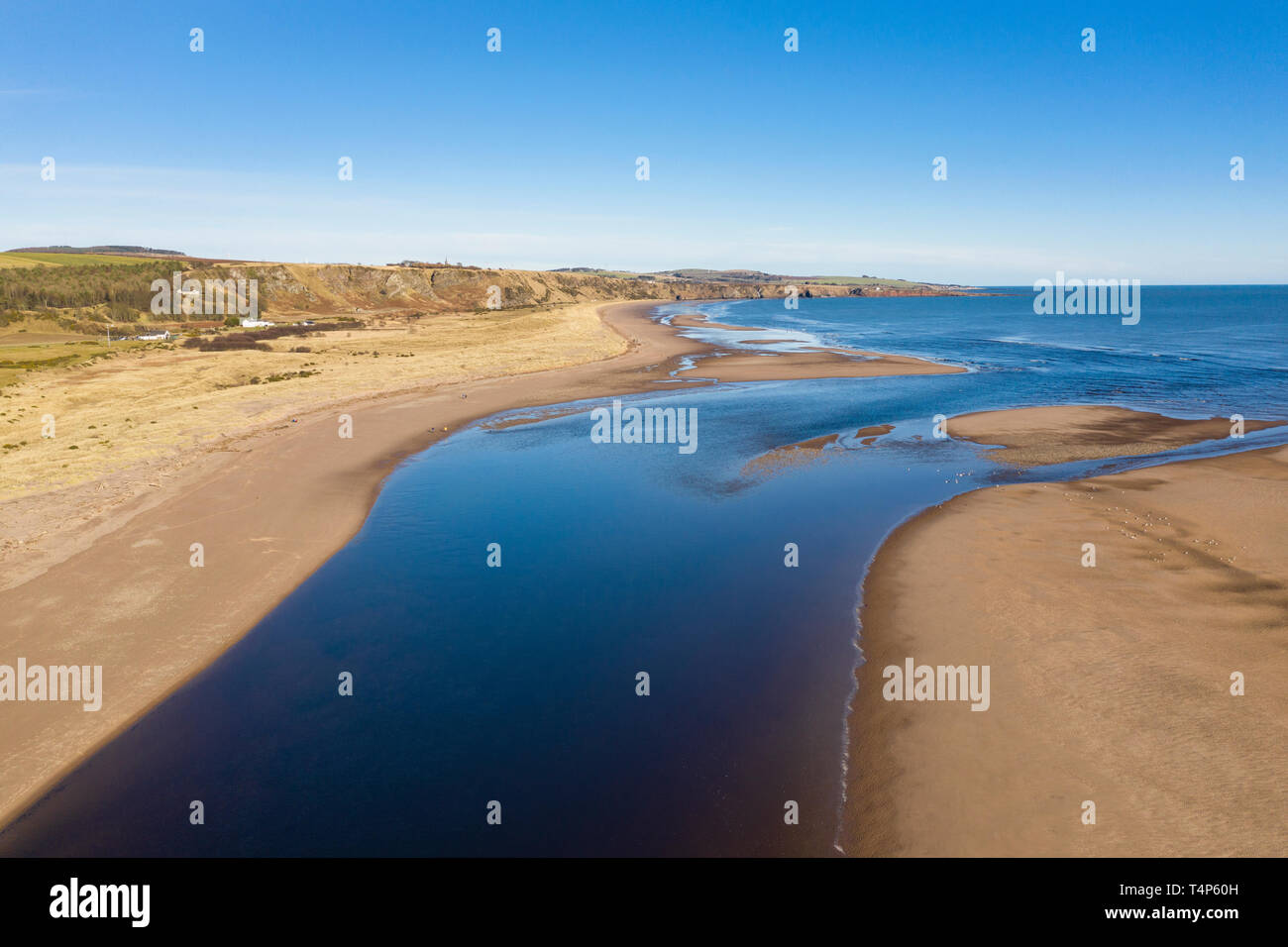 The North Esk River flows in to the North Sea. On the left bank is Aberdeenshire and on the right bank is Angus, Scotland. Stock Photo