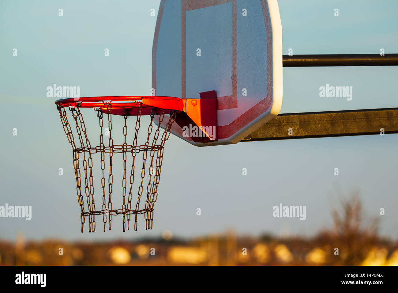 closeup of an outdoors basketball hoop at sunrise Stock Photo