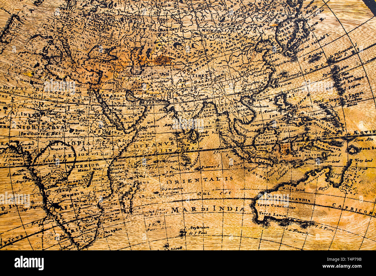 Old Geographic map of the world printed on a wooden board Stock Photo
