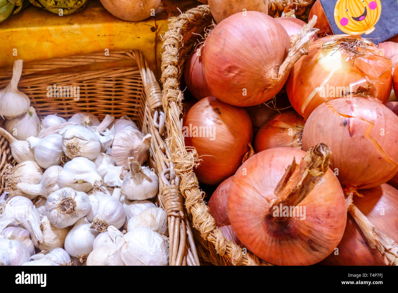 Vegetable market onions garlicks in basket Stock Photo