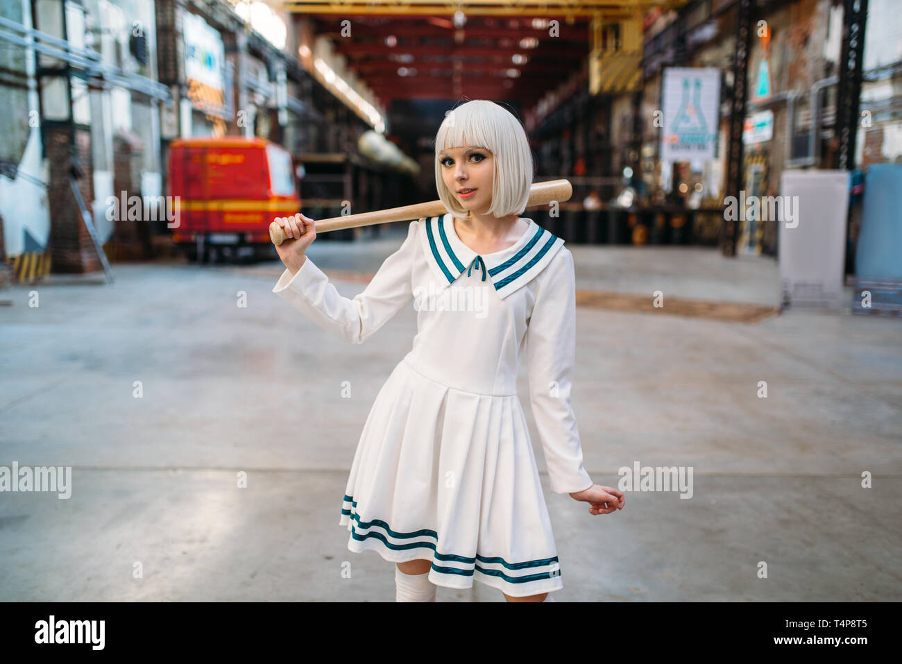 Cute anime style blonde girl with baseball bat. Cosplay fashion, asian  culture, doll in dress, sexy woman with makeup in the factory shop Stock  Photo - Alamy