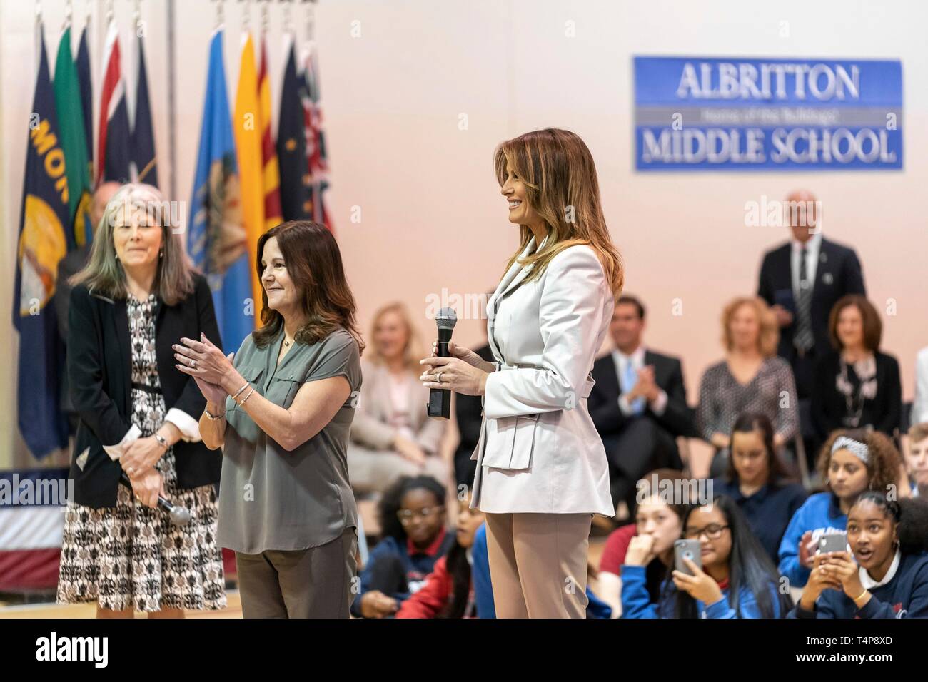 U.S First Lady Melania Trump, joined by Karen Pence, center, wife of Vice President Mike Pence, and school principal Dr. Laura Hussein, left, delivers remarks during an assembly at Albritton Middle School April 15, 2019 in Fort Bragg, North Carolina. The First Lady visited the school for military families then addressed soldiers at the base. Stock Photo