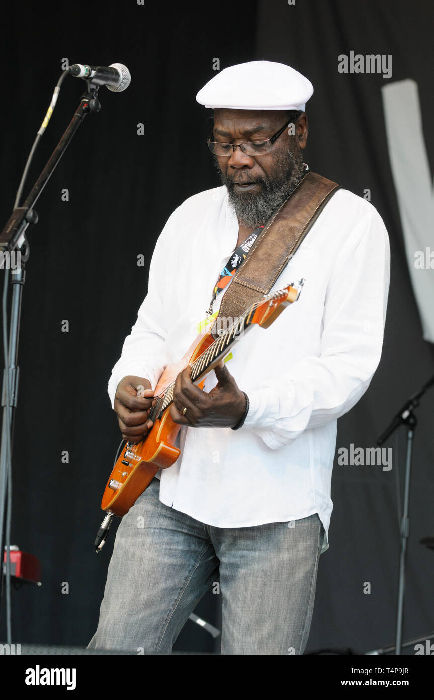 Jamaican reggae singer and musician, Clinton Fearon performing at the Womad Festival, Charlton Park, UK, July 25, 2014 Stock Photo