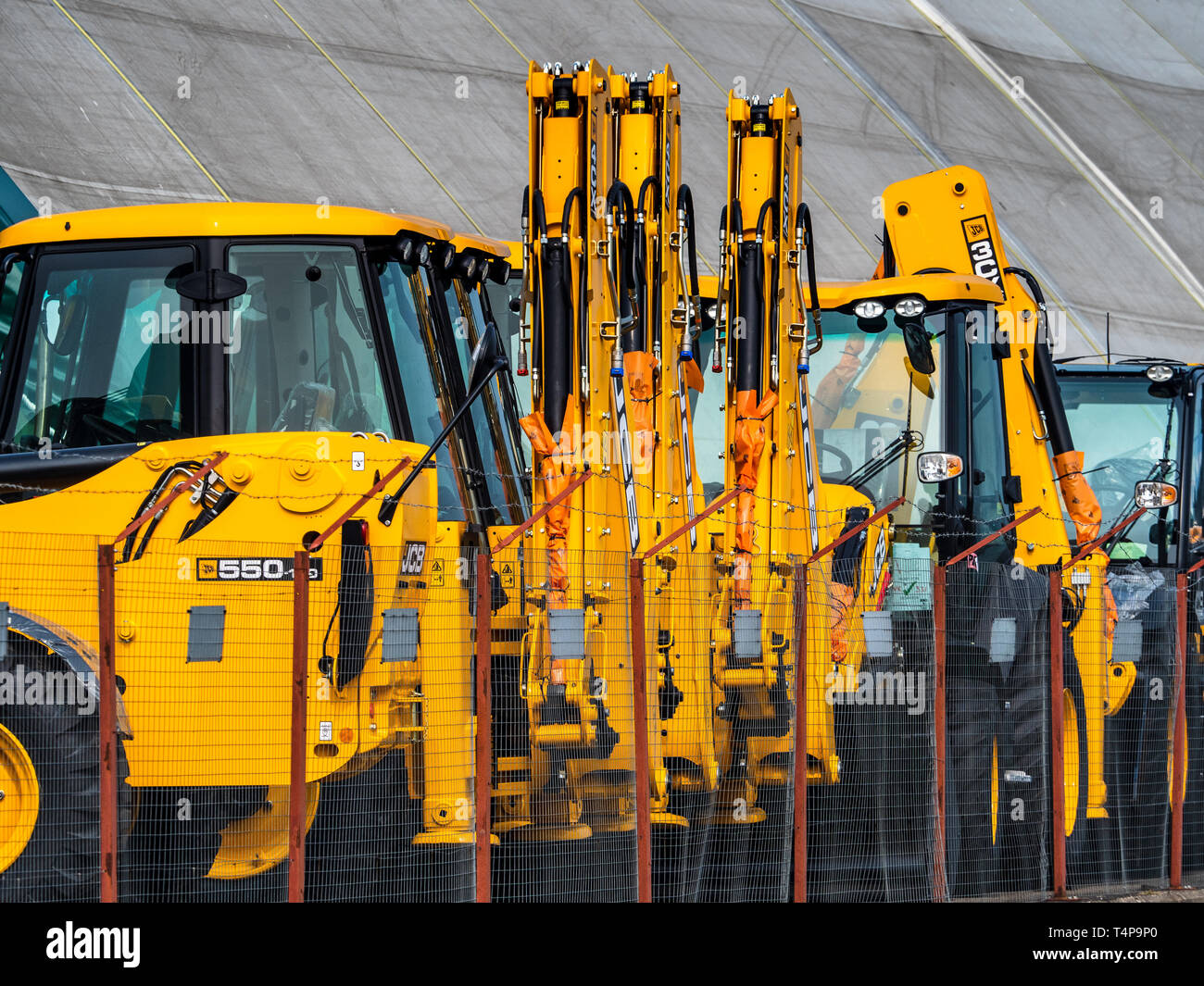 British Exports - JCB diggers or backhoe loaders  ready for export at the port of Harwich in Eastern England. Stock Photo