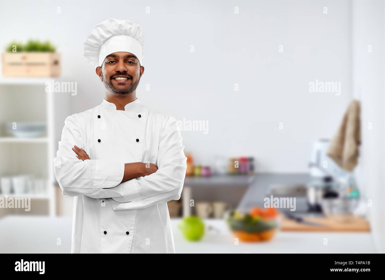 Cooking Profession And People Concept Happy Male Indian Chef In Toque Over Kitchen Background 