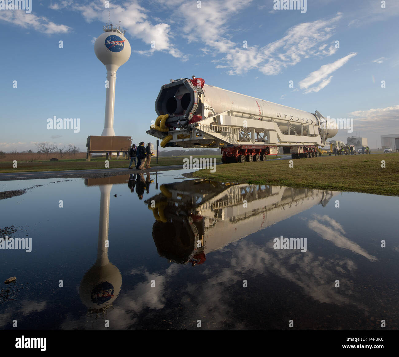 The Northrop Grumman Antares rocket, with Cygnus resupply spacecraft onboard, is rolled out to launch Pad-0A at the NASA Wallops Flight Facility April 15, 2019 in Wallops, Virginia. The rocket is schedule to deliver 7,600 pounds of science and research, crew supplies and vehicle hardware to the International Space Station on April 17th. Stock Photo