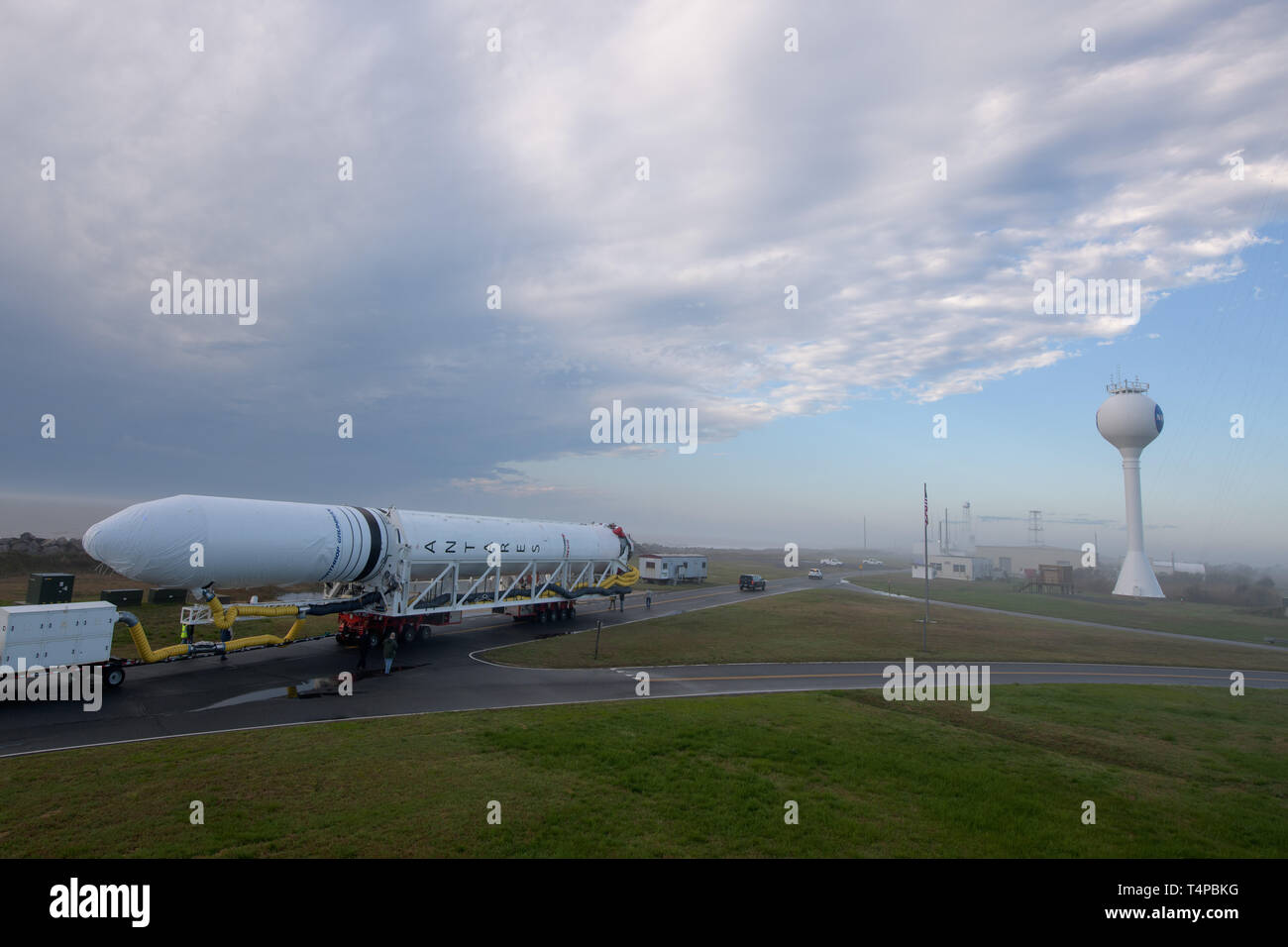 The Northrop Grumman Antares rocket, with Cygnus resupply spacecraft onboard, is rolled out to launch Pad-0A at the NASA Wallops Flight Facility April 15, 2019 in Wallops, Virginia. The rocket is schedule to deliver 7,600 pounds of science and research, crew supplies and vehicle hardware to the International Space Station on April 17th. Stock Photo