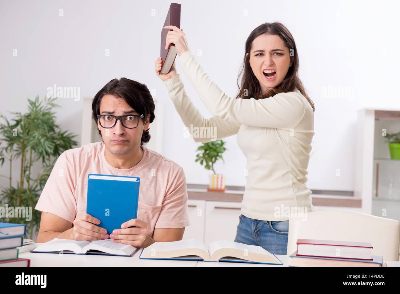 Students preparing for exam together at home Stock Photo - Alamy