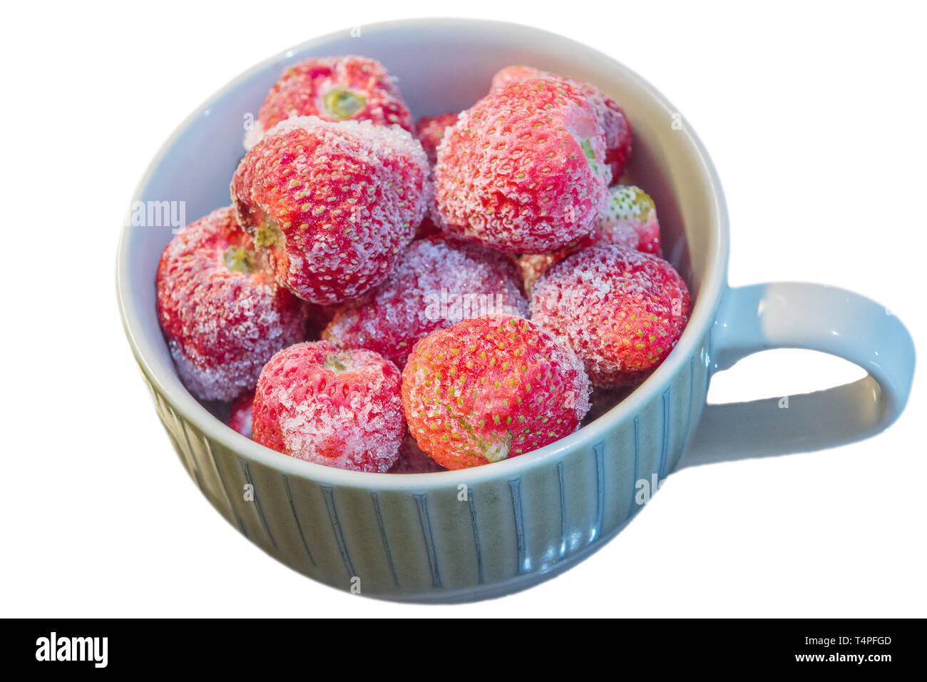 Frozen strawberries, with chunks of ice, for making smoothies, isolated against white background Stock Photo