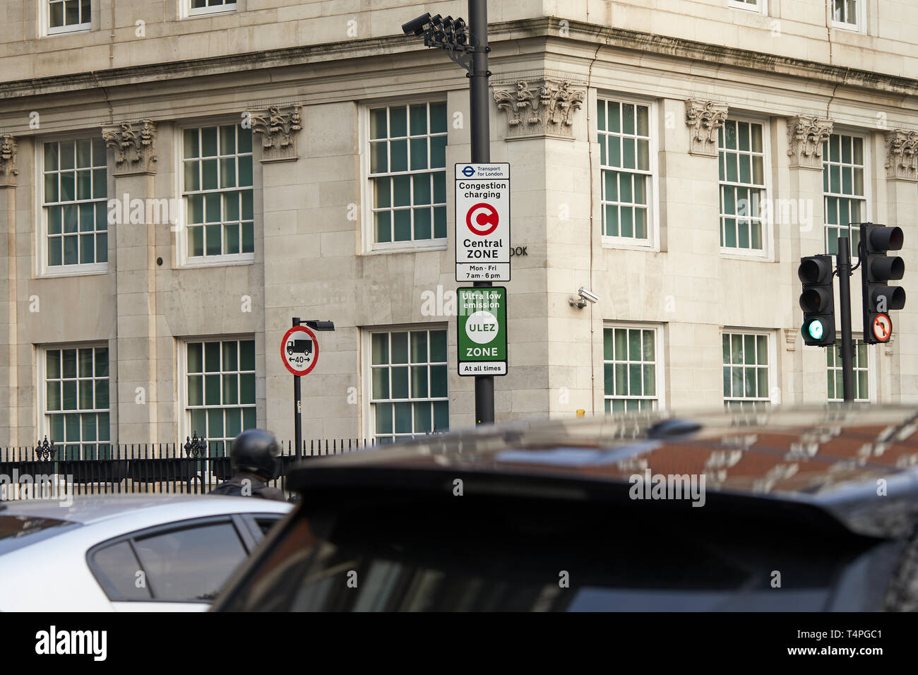 London, UK. - April 17, 2019: A sign for the new ULEZ and congestion charge zones below a series of monitoring cameras. Stock Photo