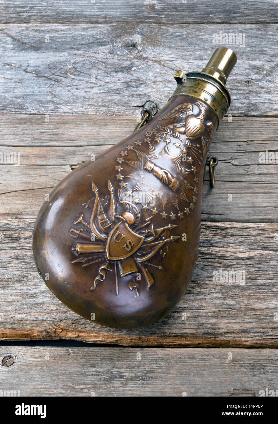 Antique eagle gunpowder flask made around made around 1838 and would of been used in the Mexican American War and Civil War by soidiers. Stock Photo