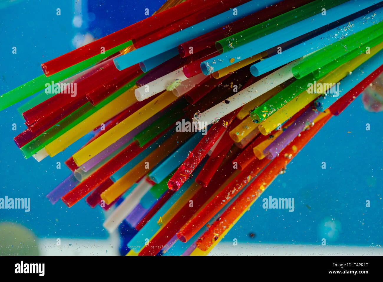 Dangerous plastic straws. Bright toxic straws made of plastic and