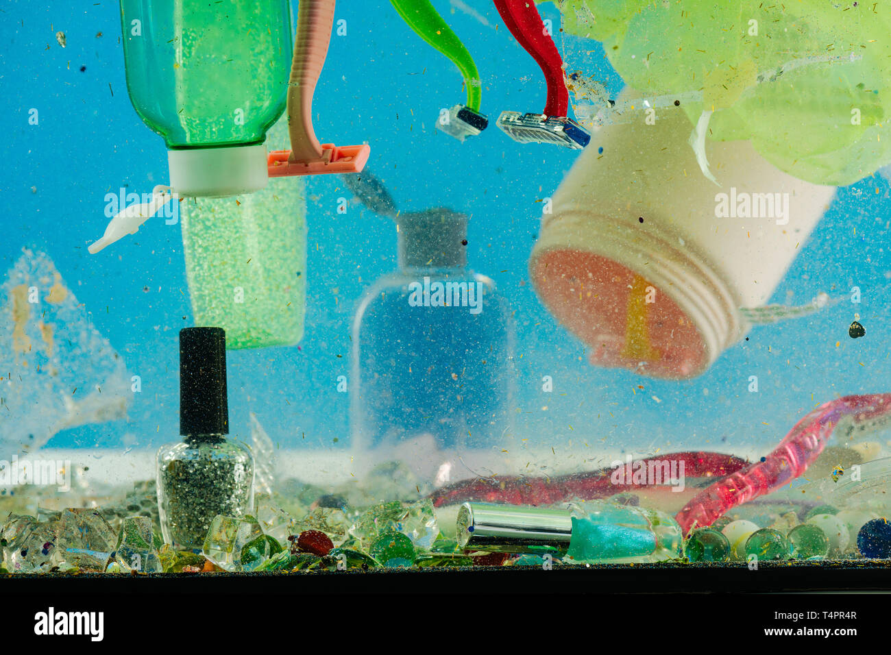 Containers swimming. Dirty muddy water being filled with plastic