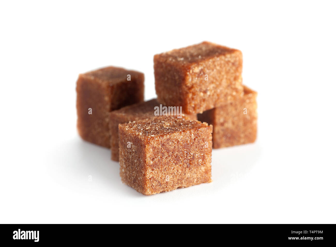 Brown sugar cubes closeup isolated on white background Stock Photo