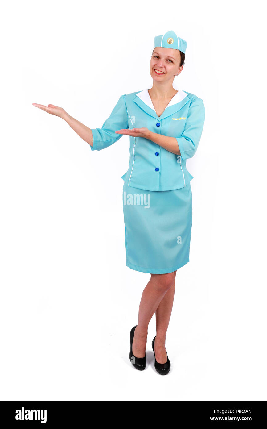 Stewardesse - Charming and smiling Stewardess Dressed In Blue Uniform Holding In Hand. Isolated on white background Stock Photo