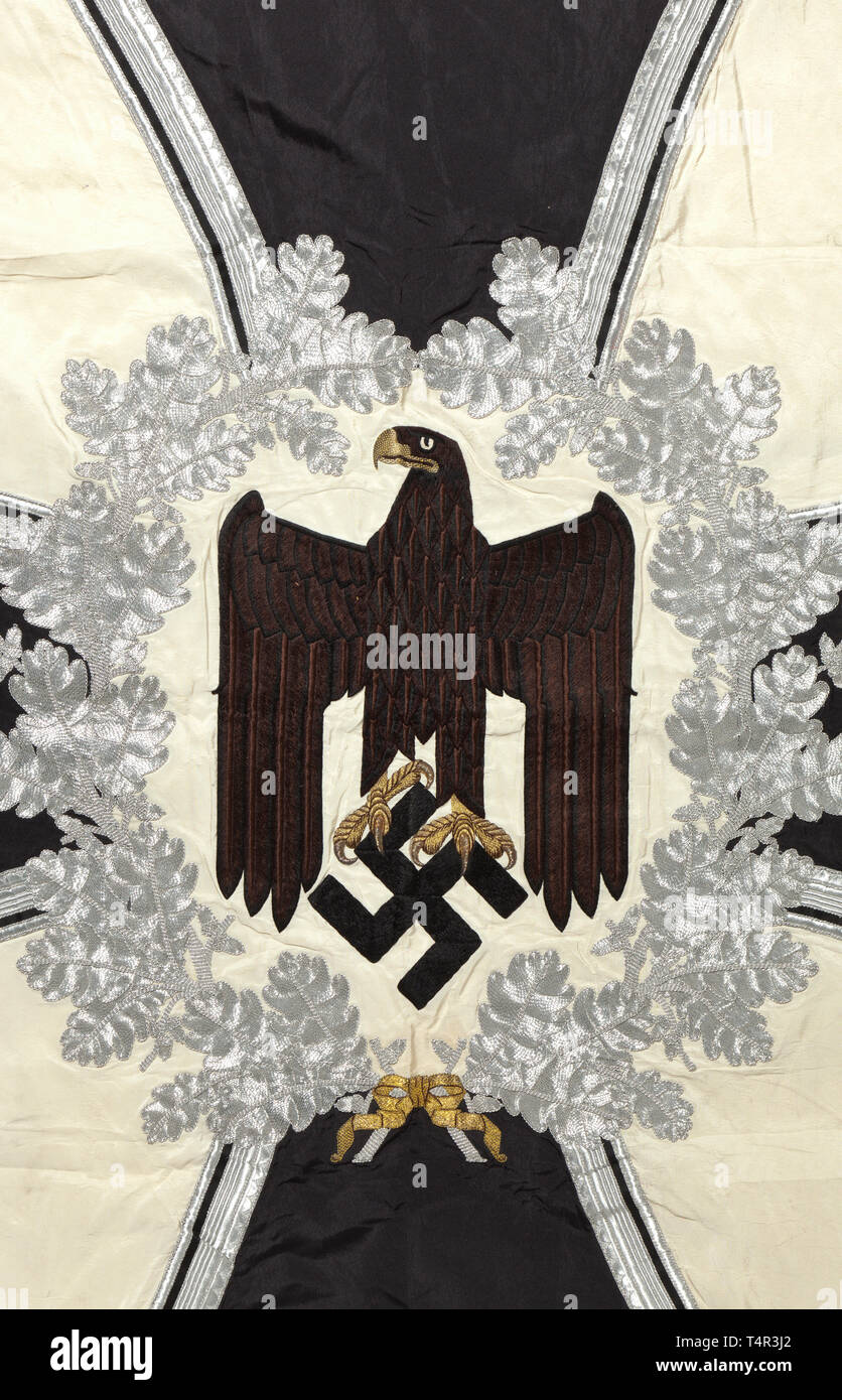 A troop flag of the infantry Made entirely of white silk with silver fringe on three sides. With a white disc on both sides, bordered by a silver embroidered oak leaf wreath with central brown army eagle, in the background an Iron Cross of black silk, bordered in silver. The corners with black swastikas, bordered in silver. Colour-fresh, the pole-sleeve with traces of nails, barely noticeable stains. Dimensions circa 120 x 120 cm. In family possessions since the end of the war. historic, historical, infantry, military, armed forces, militaria, ob, Additional-Rights-Clearance-Info-Not-Available Stock Photo