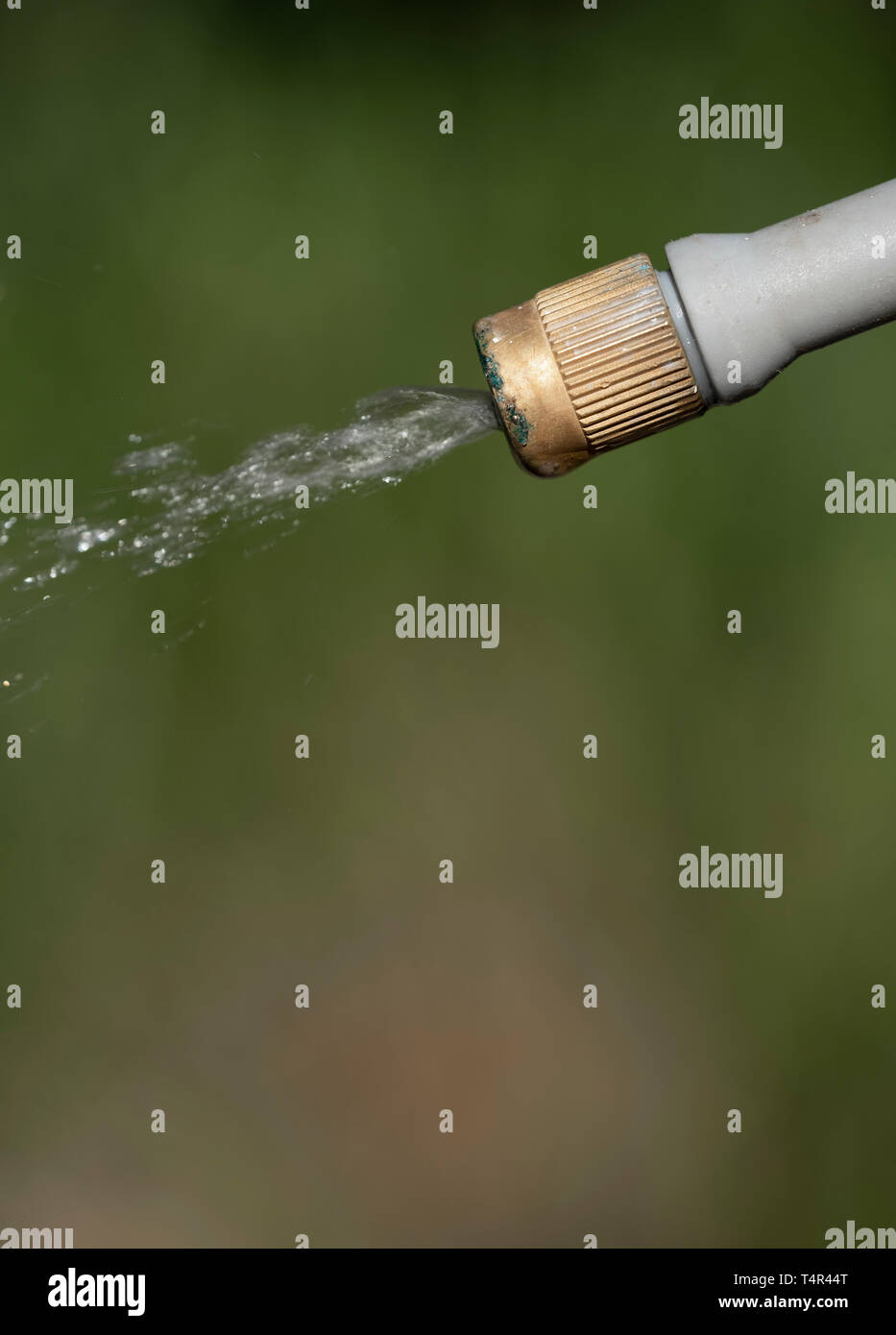 Spray nozzle releasing liquid Stock Photo Alamy