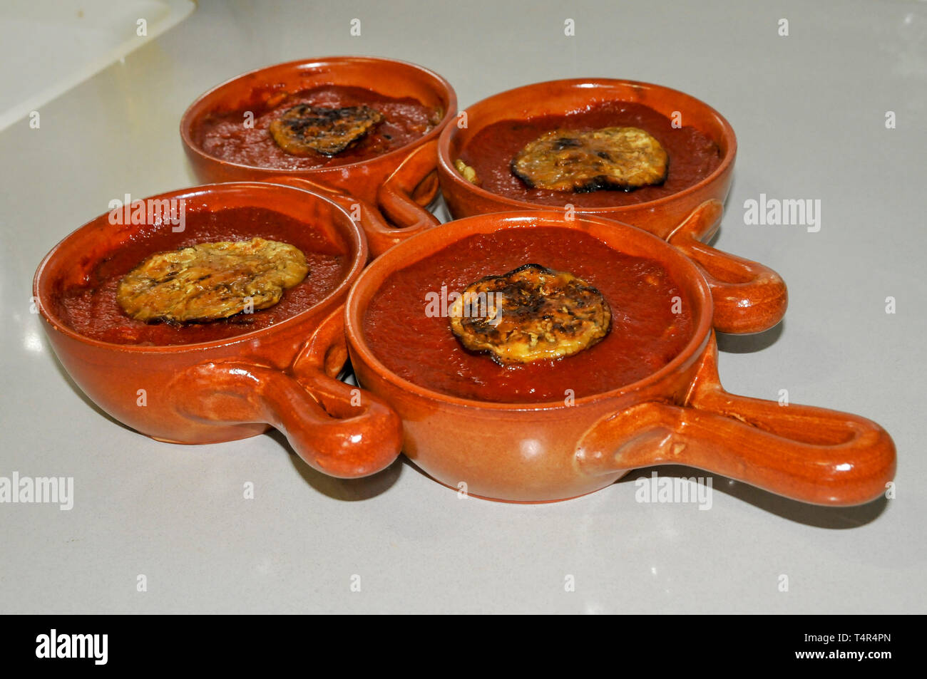 Home cooking - grilled eggplant with tomato puree Stock Photo