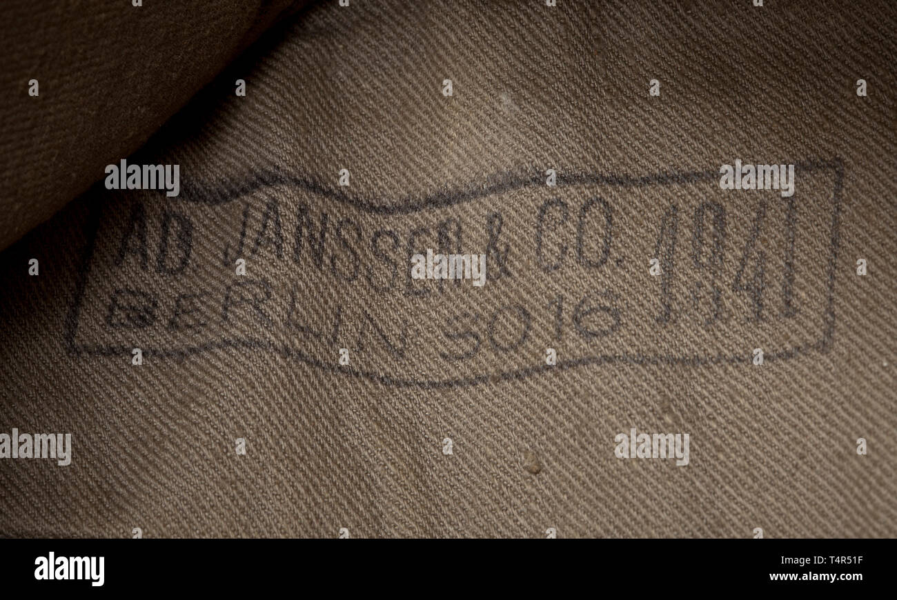 A garrison cap M 38 for enlisted men/NCOs of the infantry Depot piece of field-grey woollen cloth, field-grey painted zinc ventilation rivets, brownish inner liner with maker (Janssen & Co, Berlin) and depot stampings as well as a handwritten wearer's designation. BeVo weave insignia on a field-grey ground, white soutache chevron. historic, historical, army, armies, armed forces, military, militaria, object, objects, stills, clipping, clippings, cut out, cut-out, cut-outs, 20th century, Editorial-Use-Only Stock Photo