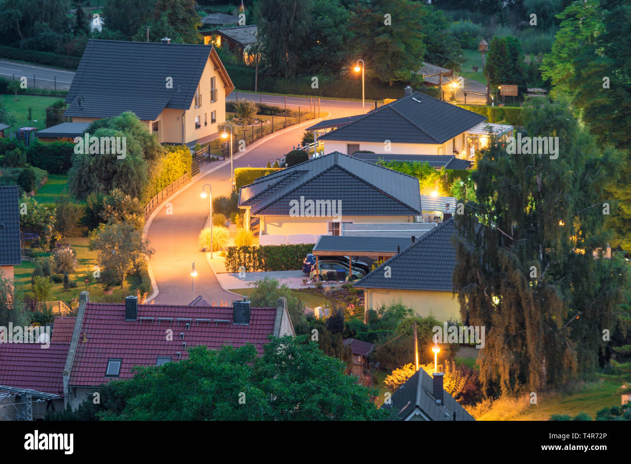 Illuminated residential area at night Stock Photo