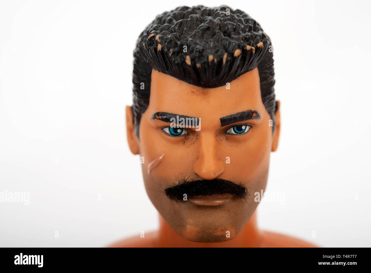 Action Man toy with homemade moustache Stock Photo