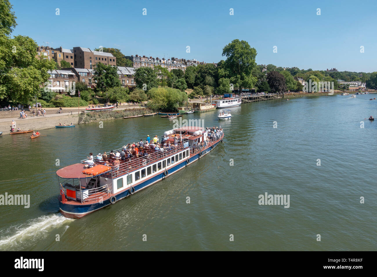 Tourist boat on the River Thames as viewed from Richmond Bridge, London, UK Stock Photo