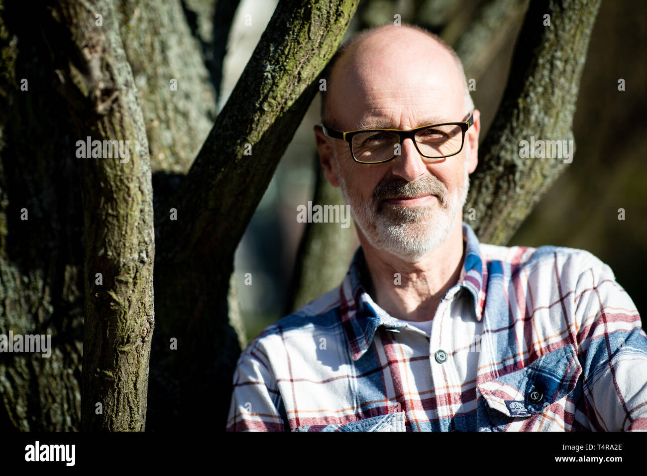 Hamburg, Germany. 17th Apr, 2019. Peter Wohlleben, forester and bestselling author, stands after a press conference at a tree on the Michelwiese. Wohlleben has published a new nature magazine together with 'Geo'. 'Wohllebens Welt' wants to invite four times a year to a guided tour through nature. The magazine is published by the Hamburg publishing house Gruner   Jahr. Credit: Christian Charisius/dpa/Alamy Live News Stock Photo