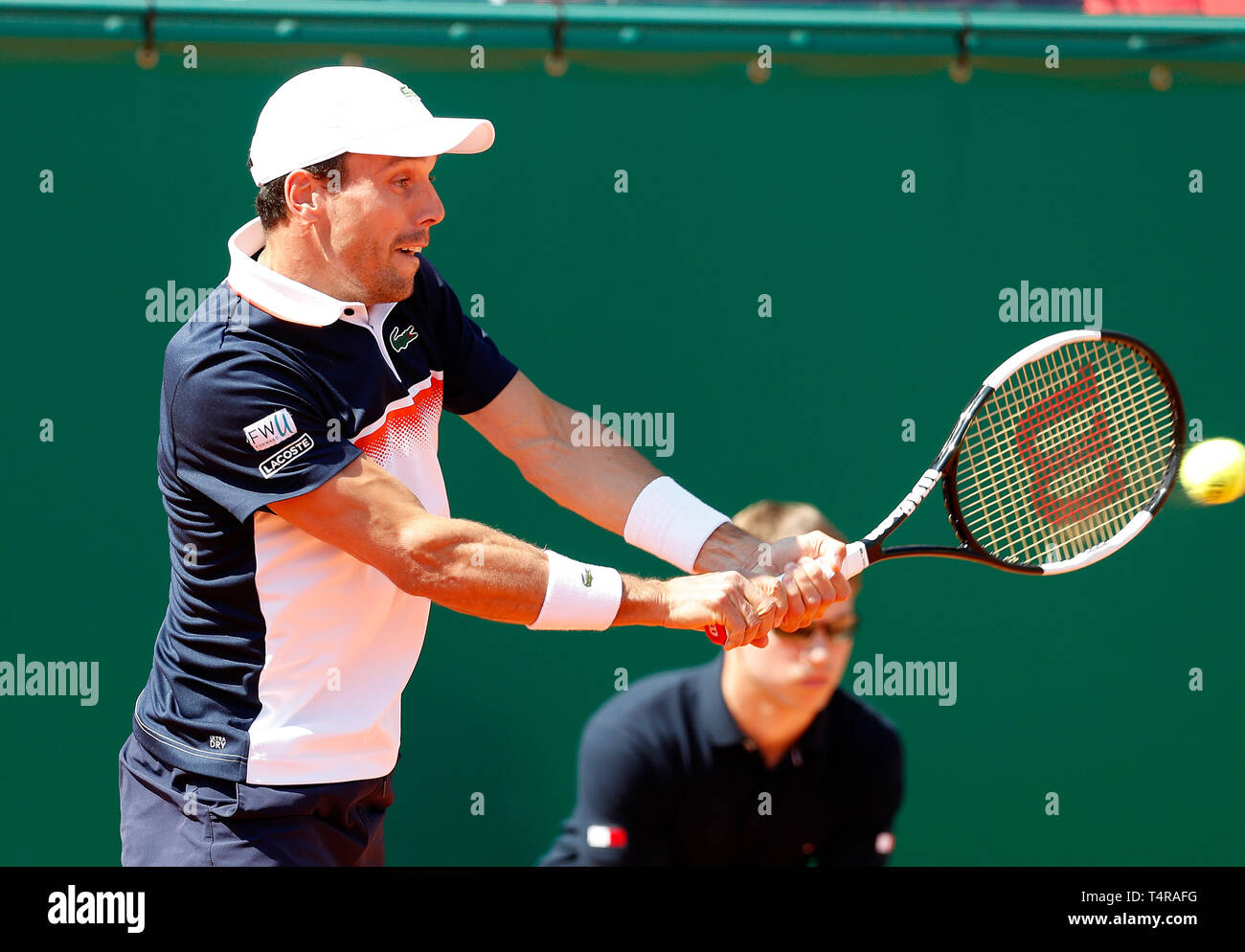 Roquebrune Cap Martin, France. 17th Apr, 2019. Roberto Bautista Agut of  Spain hits a return during the singles second match against Rafael Nadal of  Spain at the Monte-Carlo Rolex Masters tennis tournament