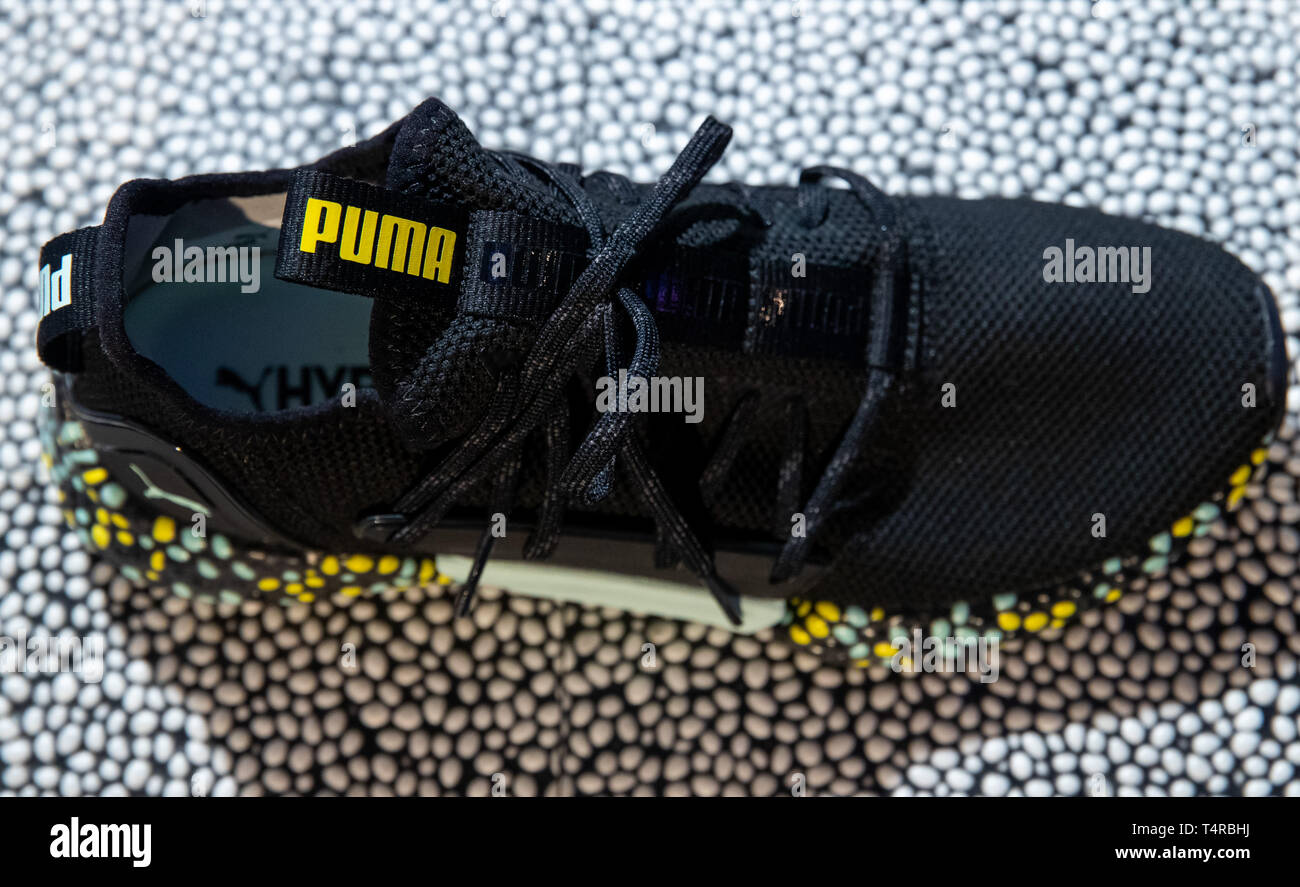 Herzogenaurach, Germany. 18th Apr, 2019. The logo of the sporting goods  manufacturer Puma stands on a shoe on the edge of the company's Annual  General Meeting. Less than a year after the