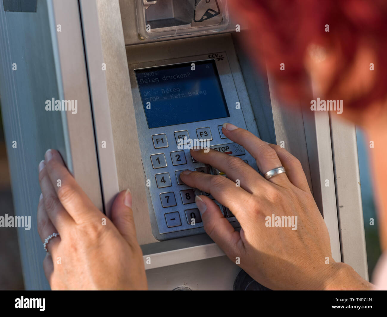 Leipzig, Germany. 17th July, 2018. A woman pays with her EC card at a terminal, taken on 17.07.2018 at a natural gas filling station in Leipzig. Credit: Thomas Schulze/dpa-Zentralbild/ZB/dpa/Alamy Live News Stock Photo