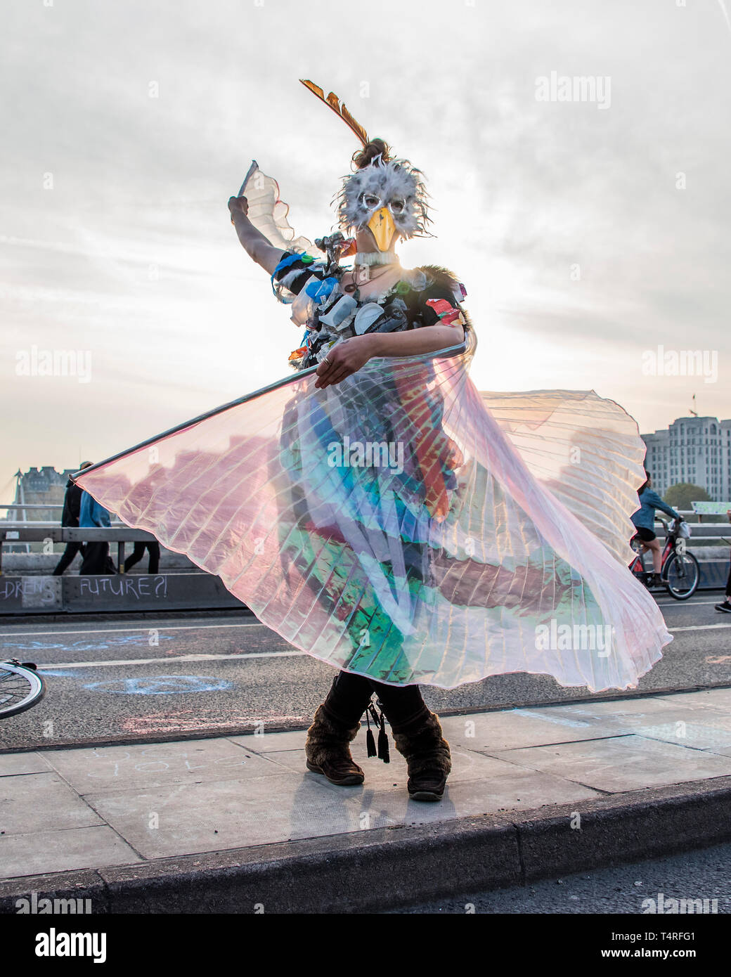 London, UK. 18th Apr 2019. Dancing in a costume representing the plastics being eaten by and then killing sea birds - Evening and the festival atmosphere returns - Day 4 - Protestors from Extinction Rebellion block several junctions in London as part of their ongoing protest to demand action by the UK Government on the 'climate chrisis'. The action is part of an international co-ordinated protest. Credit: Guy Bell/Alamy Live News Stock Photo