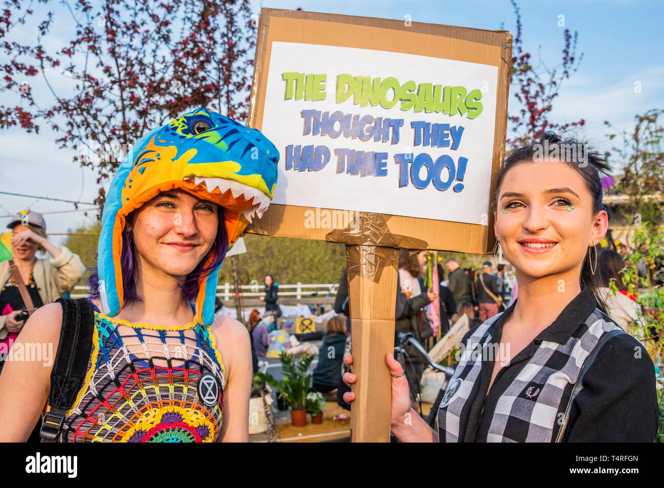 London, UK. 18th Apr 2019. The dinosaurs thought they had time too - Evening and the festival atmosphere returns - Day 4 - Protestors from Extinction Rebellion block several junctions in London as part of their ongoing protest to demand action by the UK Government on the 'climate chrisis'. The action is part of an international co-ordinated protest. Credit: Guy Bell/Alamy Live News Stock Photo