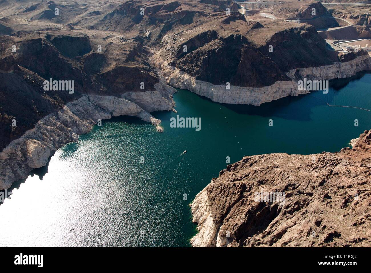Boulder City, Nevada, USA. 23rd Oct, 2015. Low waters of Lake Mead seen from above in this aerial view via helicopter. Years of unrelenting drought are straining a large reservoir of water between Nevada and Arizona. Lake Mead's water level has dropped by about 120 feet (37 meters) from where the water reached 15 years ago, on July 6, 2000. Lake Mead is no stranger to droughts. The man-made lake hit lower-than-average water levels in the mid-1950s and mid-1960s, and the current depletion is part of a decade-long trend. Lake Mead's current low level hasn't been recorded since the 1930s, when t Stock Photo