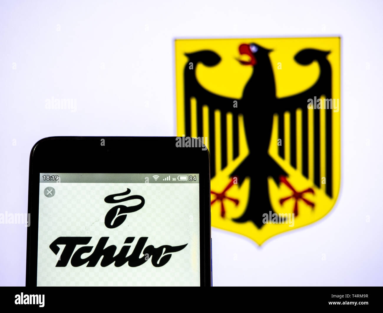 In this photo illustration a Tchibo (part of Maxinvest) logo seen displayed  on a smart phone Stock Photo - Alamy