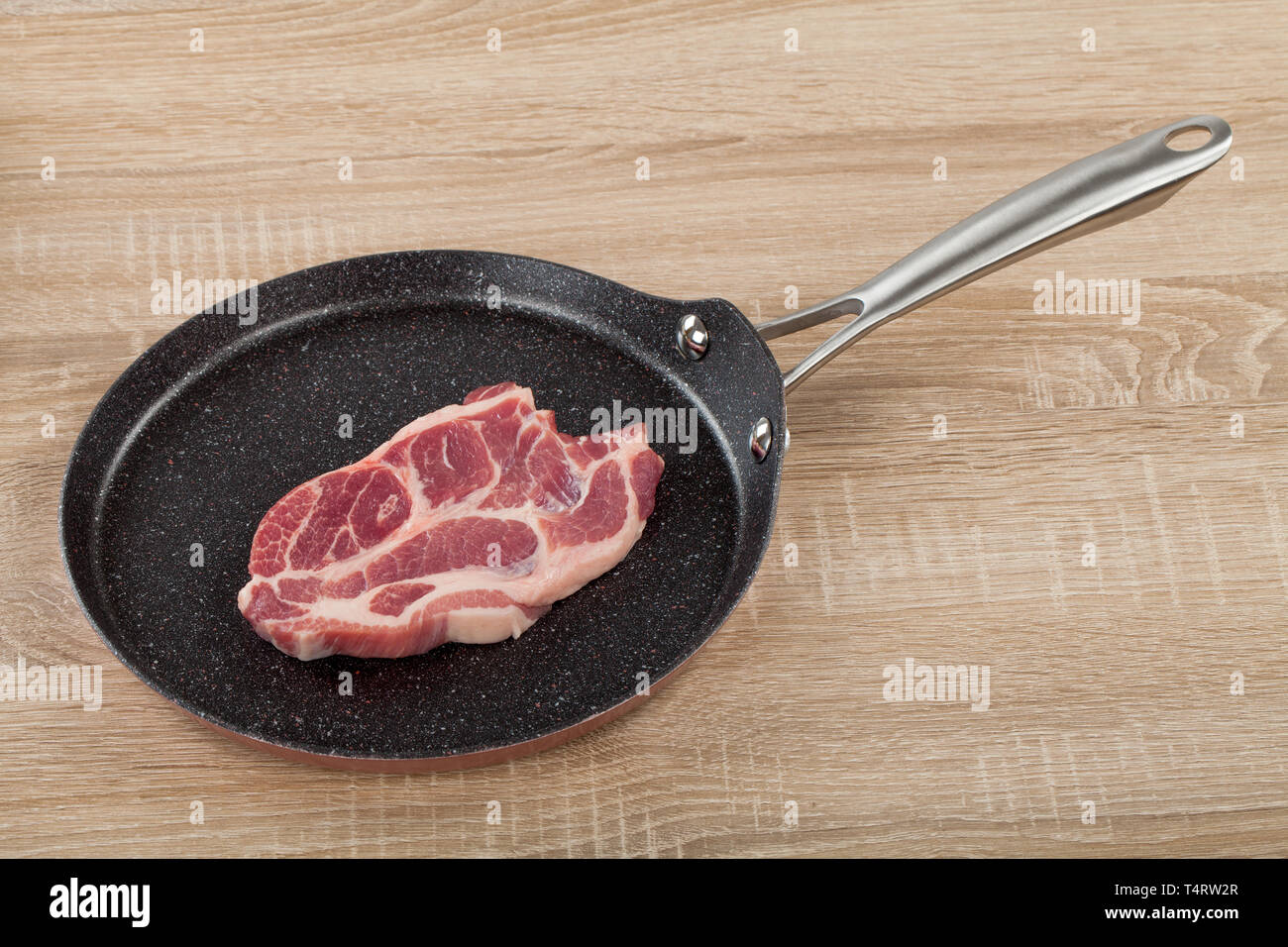 Close Up Picture Of A Beautiful Raw Pork Steak In A Non Stick